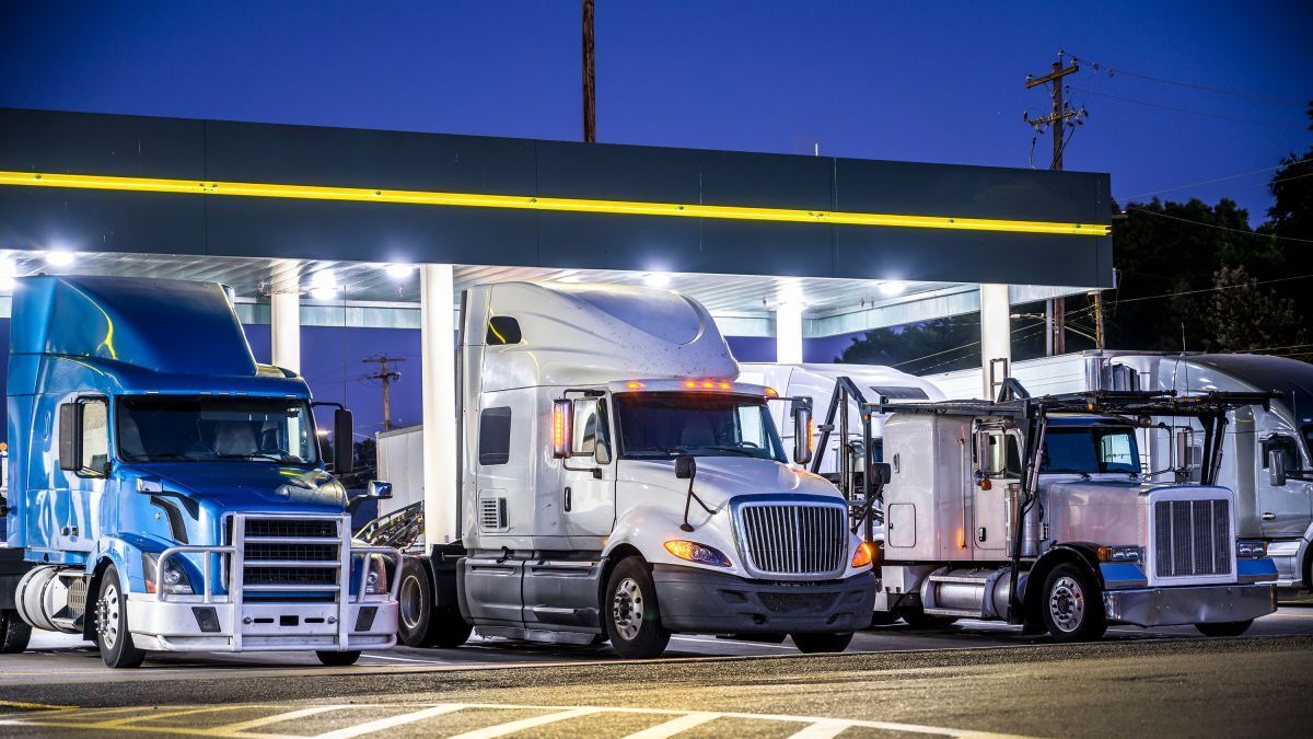 trucks in the gas station at night